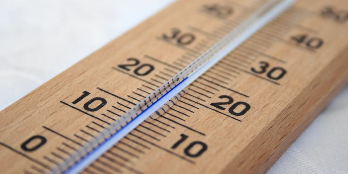 Thermostat representing extreme weather that could shut down a commercial HVAC system