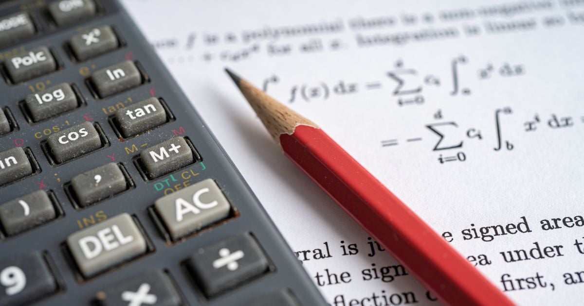 Exam paper with pencil and calculator