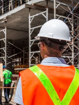 HVAC Tech looking at a construction site for a commercial building