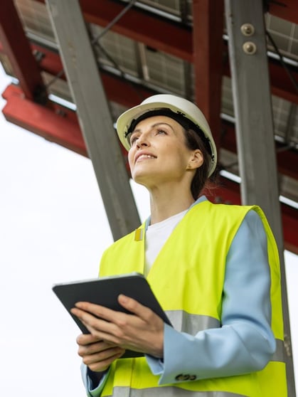 Lady in hardhat and vest