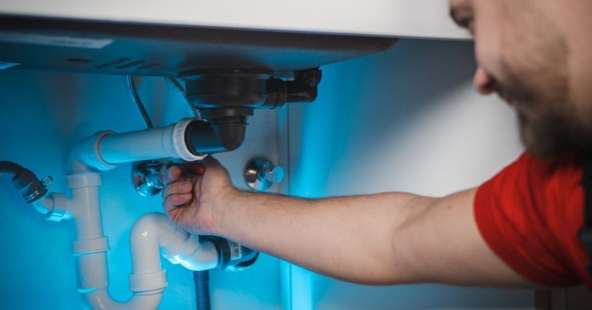 Man Working under sink