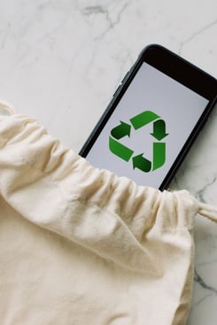 Phone with green arrows indicating green initiative