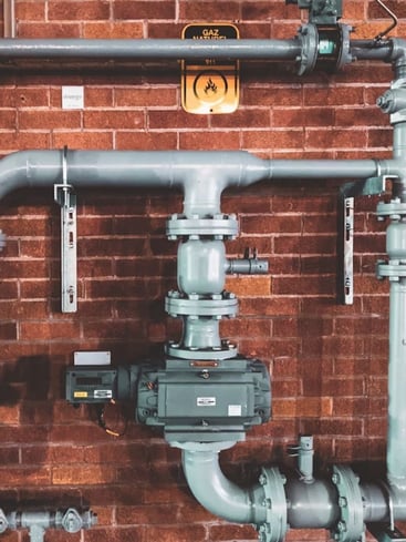 Pipes on brick wall