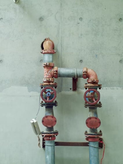 Plumbing pipes on wall