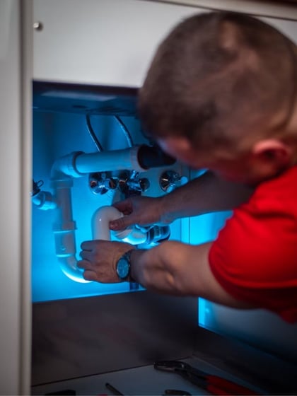 Plumbing under a sink