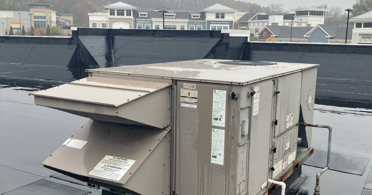 RTU getting preventative maintenance on a cloudy day