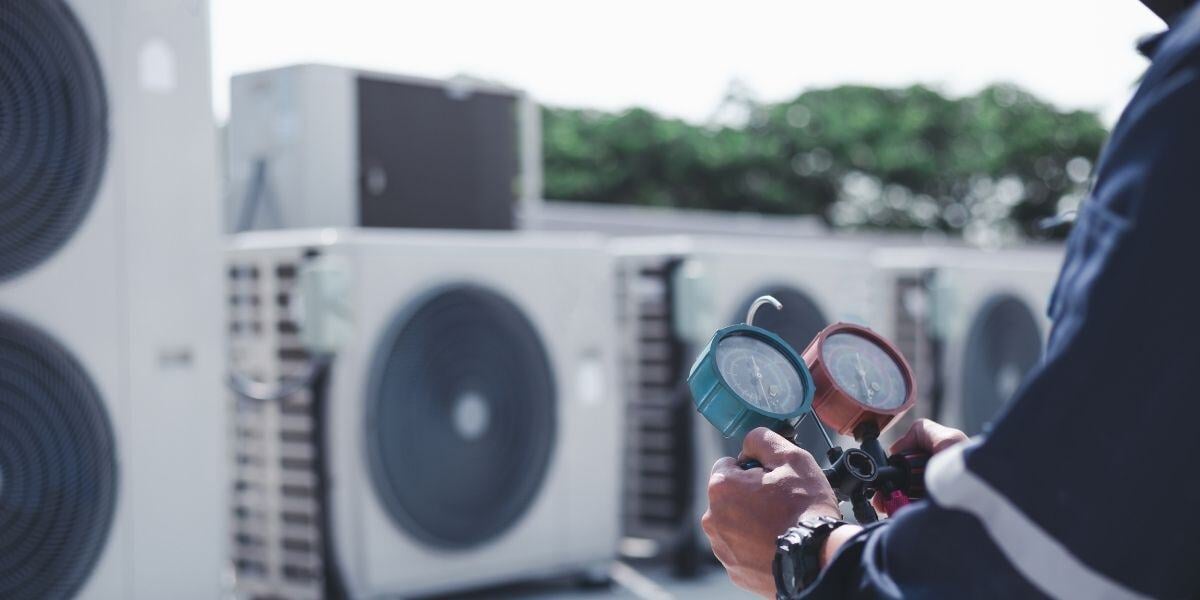 Tech on Roof with measuring equipment-1