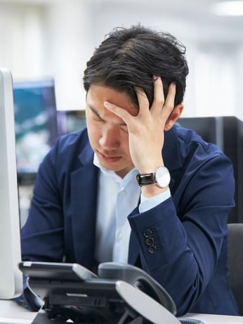Worker frustrated by stuffy and uncomfortable office temperatures