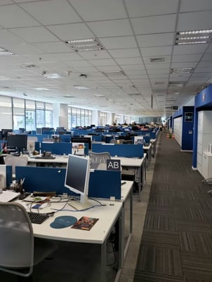 Office in a commercial building with many desks and computers that could cause load issues