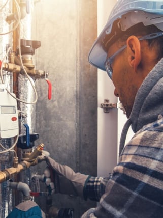 HVAC professional working on a commercial building system