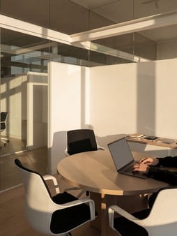 Office room with windows and a more open layout that will heat and cool at different rates than other rooms