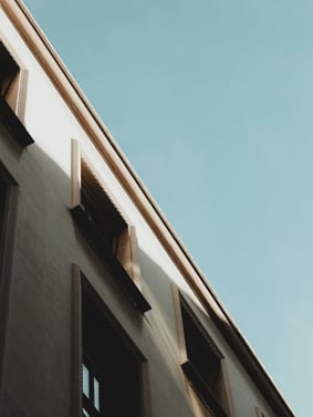A building with many windows that could experience air leaks