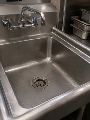 Commercial building kitchen drain that is prone to build up and clogs 