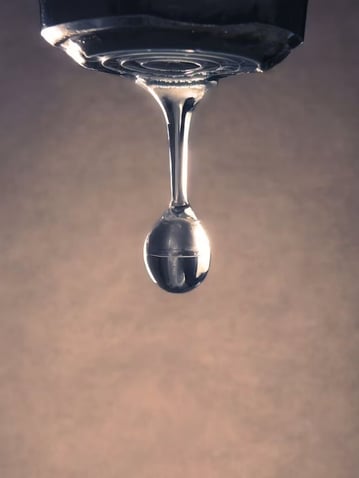 Water droplet representing plumbing leaks in commercial buildings