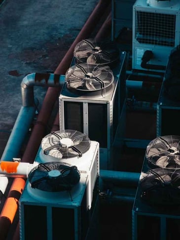 Rooftop HVAC equipment that needs maintenance.