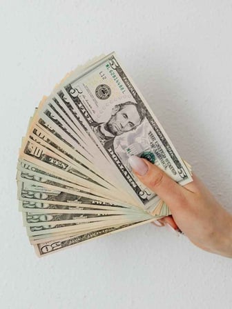 Money fan representing savings from doing a commercial HVAC upgrade