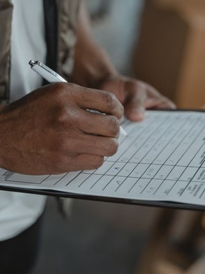 HVAC technician going over the standard checklist while at a commercial building to do preventative maintenance