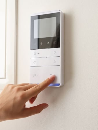 A thermostat for a commercial building that is connected to an HVAC temperature sensor