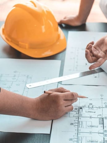 Contractor going over building plans 