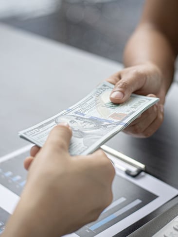 money being handed to someone